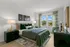 Primary bedroom with oversized windows