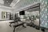 Fitness center benches in front of mirror