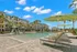 Swimming pool with lounge chairs and umbrellas