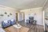 Living room, 2 blue chairs, entertainment center