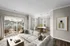 Spacious living room with plank flooring. Dining room to the right. Spacious balcony and large windows.