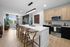 Unit interior kitchen, quartz countertops, dual tone cabinets, designer backsplah