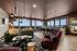 Sky lounge with views, hospitality bar, lounge seating, terrace
