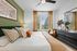 Modern bedroom with large bed and dresser, ceiling fan and large window