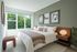 Spacious bedroom with large windows