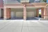 Spacious triple garage space with modern brick and siding exterior, perfect for multi-car families and ample storage.