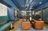 Co-working lounge with soft seating and micro offices