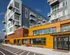 Modern apartment complex with sleek architecture, featuring expansive balconies and vibrant exterior design.