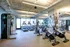 Modern fitness center boasting state-of-the-art exercise bikes, treadmills, and strength training equipment.