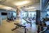 Contemporary fitness center with state-of-the-art equipment, natural lighting, and chic interior design, perfect for an invigorating workout experience.