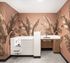 Chic laundry room with vibrant leaf-patterned wallpaper, featuring modern cabinetry and a spacious sink.