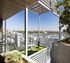 Luxurious rooftop terrace with lush green landscaping, offering panoramic city views and stylish modern design.