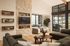 Clubhouse lounge with limestone feature wall and plush seating at Sonora in Austin, TX