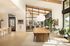 Clubhouse dining area with long wood table and pendant light at Sonora in Austin, TX