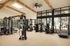 Fitness center with modern equipment and wood-beam ceiling at Sonora in Austin, TX