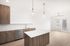 Kitchen with wood cabinets, island and glass patio doors at Sonora in Austin, TX