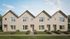 Row of modern townhomes with gabled roofs at The Row, Sonora in Austin, TX
