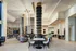 Luxurious modern clubroom with elegant seating, unique architectural details, and ambient lighting, perfect for relaxation and gatherings.