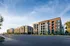 Modern urban apartment community showcasing contemporary architecture with vibrant facades and large windows