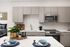 Modern kitchen with sleek cabinetry, stainless steel appliances, and elegant dining setup, perfect for stylish urban living.