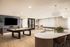 Modern game room with elegant pool table, stylish seating area, and ambient lighting, perfect for entertainment.