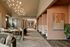 Chic open-concept apartment with contemporary lighting, plush seating, and stylish dining area exudes luxury.