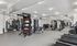 Modern fitness center with state-of-the-art equipment, spacious layout, and sleek design features.