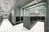 Elegant apartment lobby with modern mailboxes, art deco chandeliers, and stylish tile flooring.