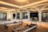 Elegant fitness room at Azur featuring luxurious reformer Pilates equipment, surrounded by modern mirrors and soft ambient lighting.