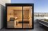 Luxurious outdoor sauna with sleek wooden interior and panoramic city views.