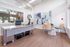 Modern office space with sleek desk, stylish decor, and natural light.