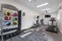 Modern fitness center with state-of-the-art exercise equipment, vibrant kettlebells, and sleek design.