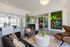 Inviting apartment lobby with modern seating, vibrant decor, and a stylish reception area.