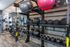 Modern fitness center equipped with kettlebells, medicine balls, and TRX suspension trainers, providing a versatile workout environment.