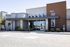 Modern commercial building with clean architectural design and welcoming entrance, located at address 9201.