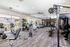 Bright and modern fitness center with state-of-the-art equipment and ample natural light.