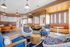 Bright and modern communal lounge featuring stylish seating, warm lighting, and cozy dining nooks perfect for socializing or relaxing.