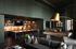 Luxurious open-concept lounge featuring a stylish kitchen, elegant pool table, and cozy seating area with modern decor.