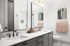 Modern bathroom with elegant dual sinks, sleek black fixtures, and stylish decor offering a luxury spa ambiance.