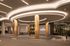 Elegant entrance of The Parson featuring modern architecture, illuminated columns, and a sophisticated ambiance.