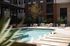 Outdoor swimming pool and sundeck at Odell Apartments