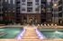 Resort-style pool and lounge chairs at Odell Apartments