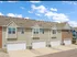 Two car garage connected to other buildings