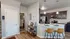 Chic modern kitchen with sleek dark cabinets, granite countertops, and stylish bar seating, perfect for entertaining.