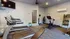 Inviting fitness center featuring modern treadmills, exercise bike, and weight station, ideal for home workouts.