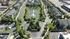 Aerial view of a beautifully landscaped apartment complex with a tranquil pond, dual fountains, and tree-lined streets creating a serene residential atmosphere.