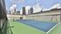 Rooftop tennis court with downtown skyline views