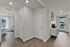 Inviting entryway with wood-style flooring and modern finishes.