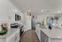 Fully equipped kitchen with granite countertops and sleek finishes.