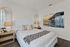 Cozy bedroom retreat with stylish coastal-inspired decor.